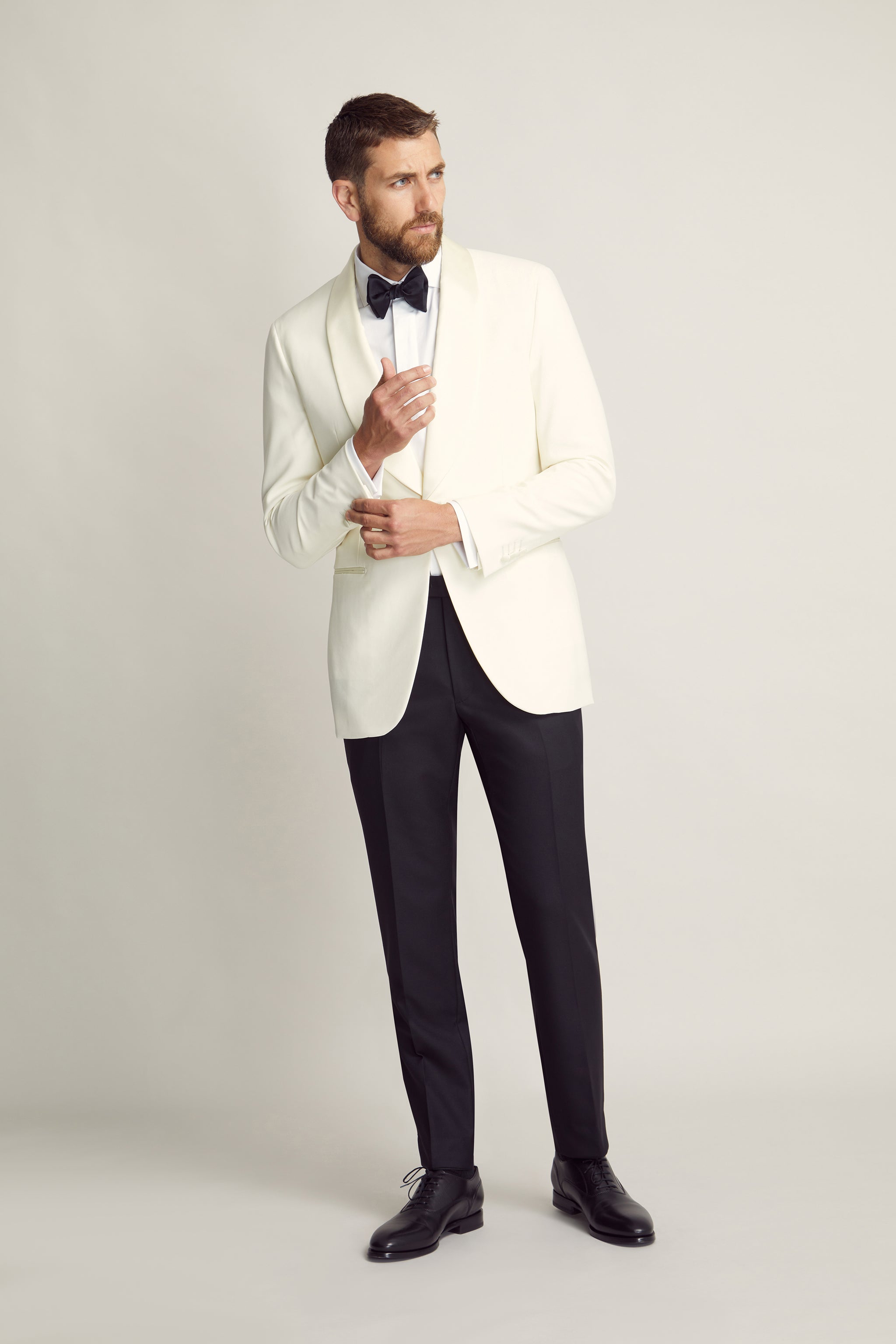 Light Cream Wool Tuxedo Jacket with black trousers custom tailored in Sydney Australia.